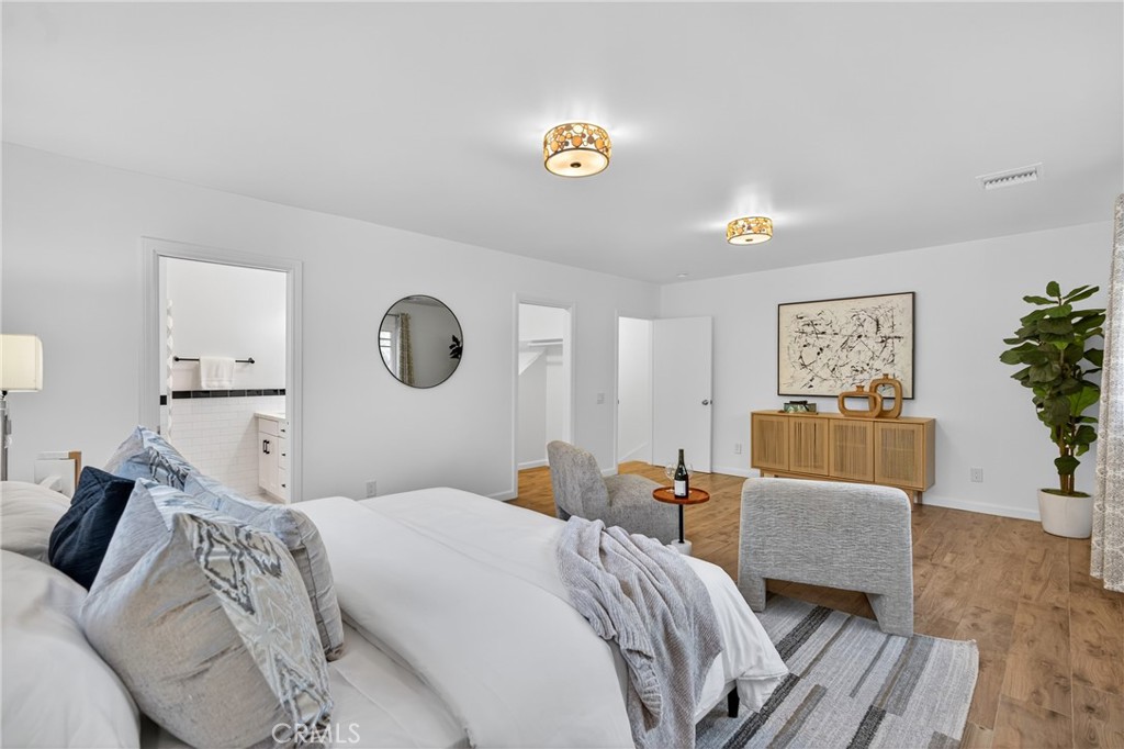 7576-7582 McGroarty Terrace Los Angeles, CA 91042 - Photo 36 of 47 a bedroom with a bed and a couch