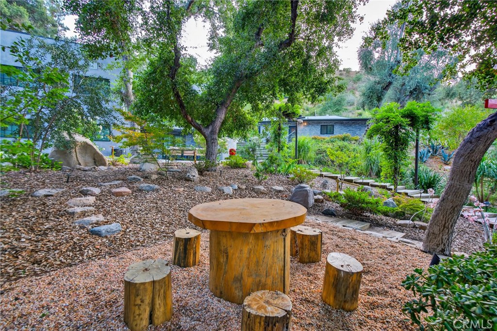 7576-7582 McGroarty Terrace Los Angeles, CA 91042 - Photo 44 of 47 a view of a backyard with plants and tree
