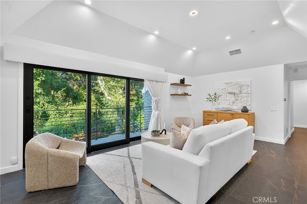 7576-7582 McGroarty Terrace Los Angeles, CA 91042 - Photo 6 of 47 a living room with furniture and a large window