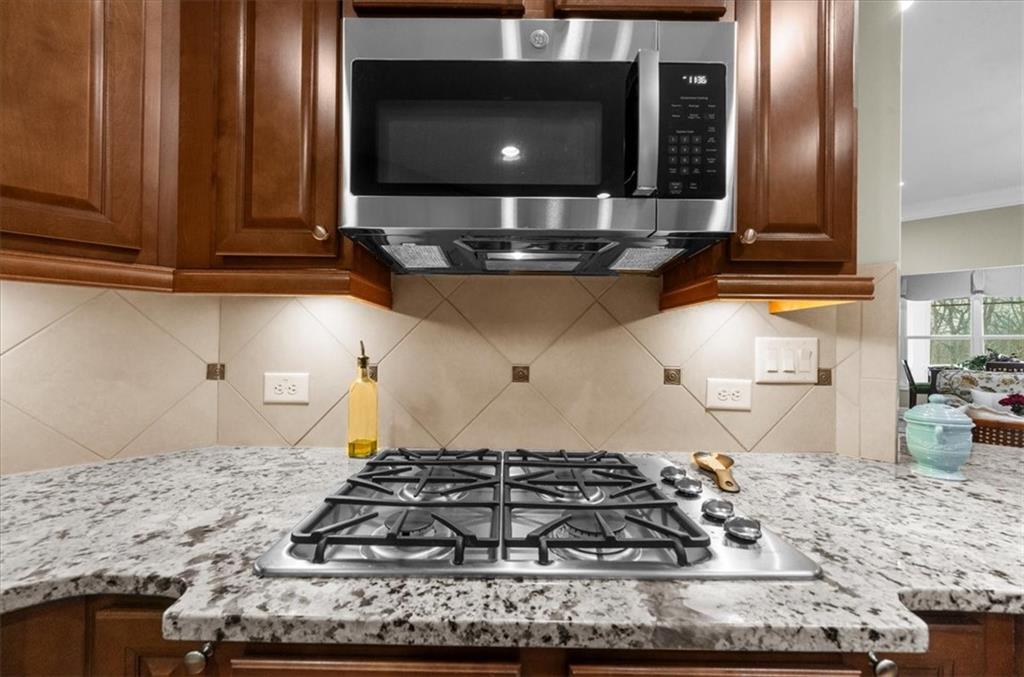 3357 Locust Cove Road Gainesville, GA 30504 - Photo 14 of 77 a kitchen with a stove and a microwave