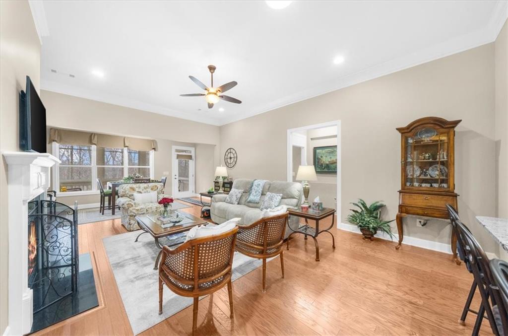 3357 Locust Cove Road Gainesville, GA 30504 - Photo 18 of 77 a living room with fireplace furniture and a wooden floor