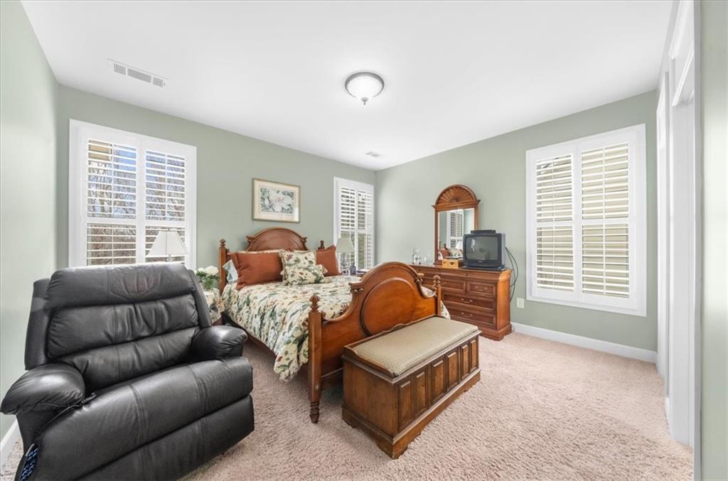 3357 Locust Cove Road Gainesville, GA 30504 - Photo 24 of 77 a bedroom with furniture and a window
