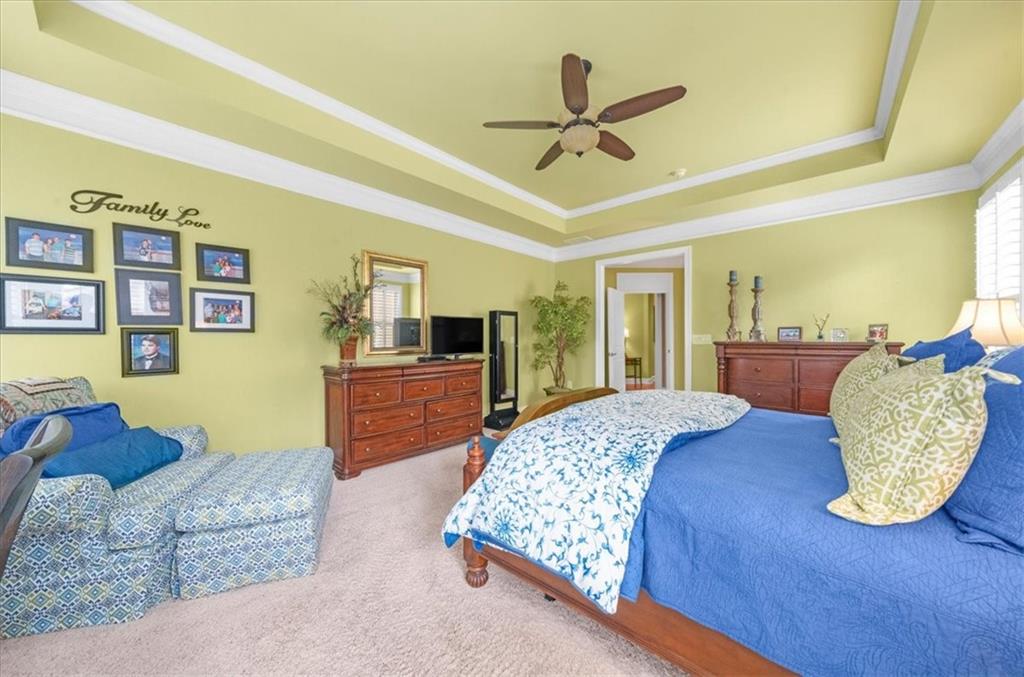 3357 Locust Cove Road Gainesville, GA 30504 - Photo 29 of 77 a bedroom with a large bed and a chandelier
