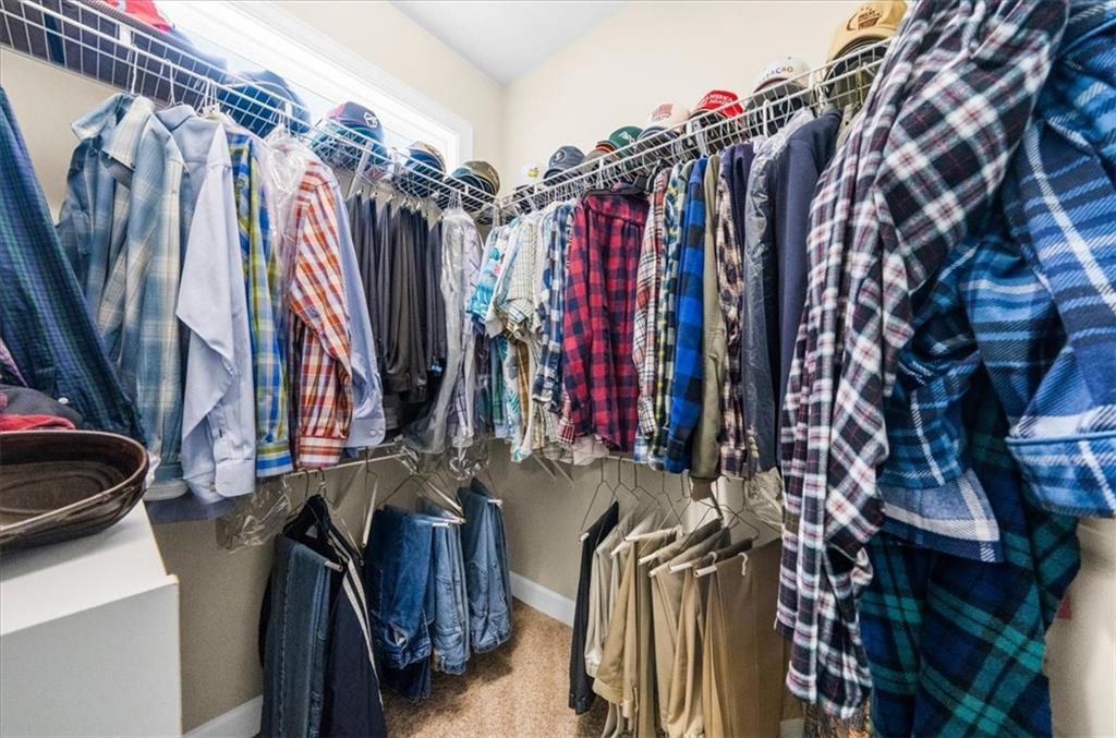 3357 Locust Cove Road Gainesville, GA 30504 - Photo 34 of 77 a view of walk in closet with clothes