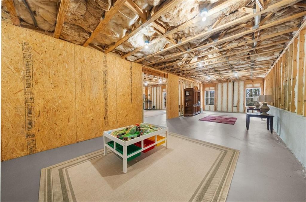 3357 Locust Cove Road Gainesville, GA 30504 - Photo 35 of 77 a living room with furniture and a table