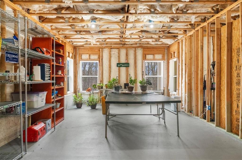3357 Locust Cove Road Gainesville, GA 30504 - Photo 40 of 77 a dining room with furniture and a chandelier