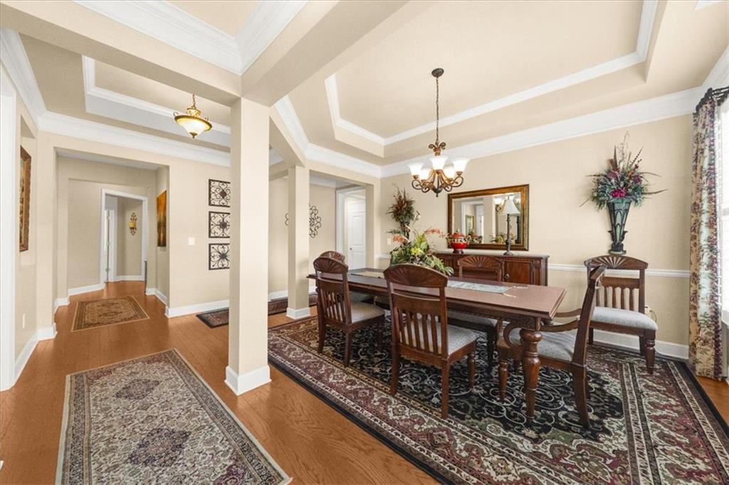 3357 Locust Cove Road Gainesville, GA 30504 - Photo 5 of 77 a dining room with wooden floor and a rug