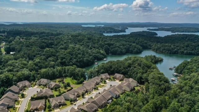3357 Locust Cove Road Gainesville, GA 30504 - Photo 51 of 77 an aerial view of a city with lots of residential buildings and mountain view in back