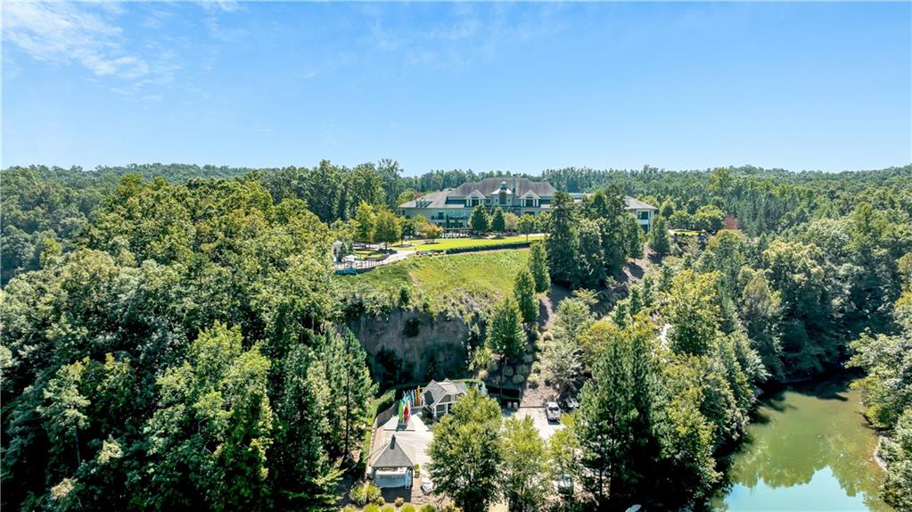 3357 Locust Cove Road Gainesville, GA 30504 - Photo 52 of 77 a view of a lake with a house in the background
