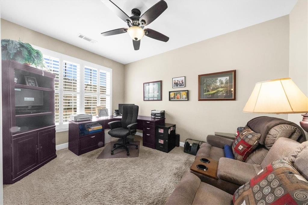 3357 Locust Cove Road Gainesville, GA 30504 - Photo 9 of 77 a living room with furniture and a flat screen tv