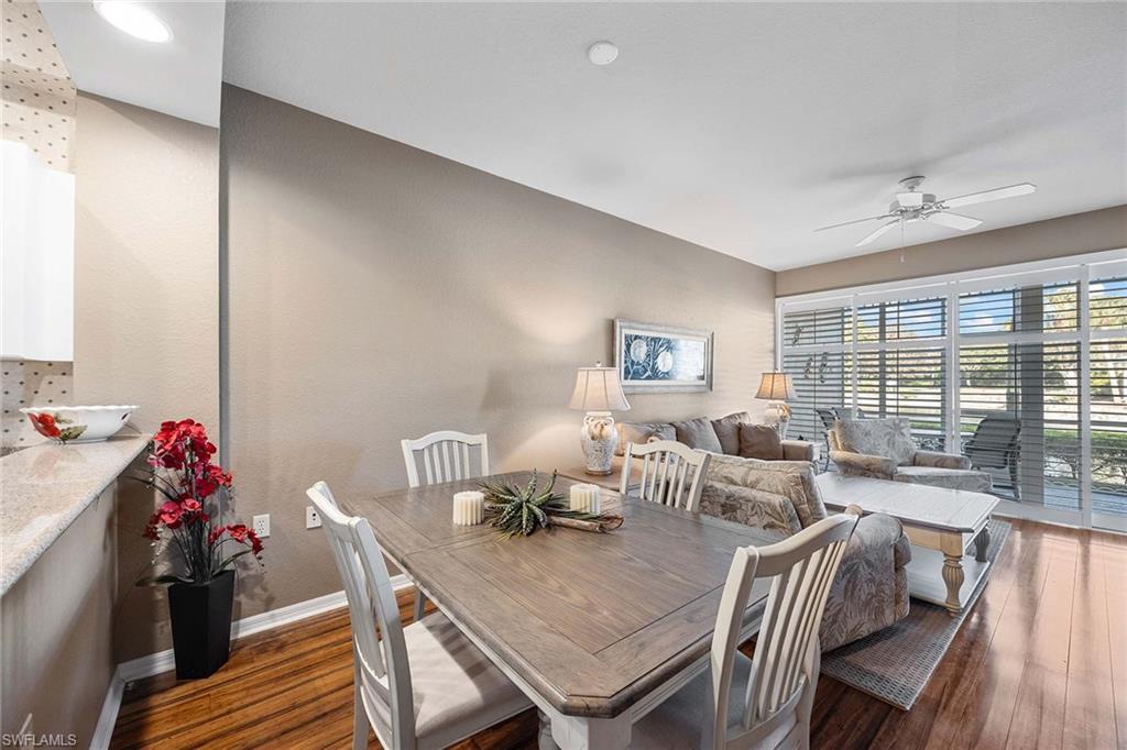 Undisclosed Address Naples, FL 34113 - Photo 11 of 38 a view of a dining room with furniture window and outside view
