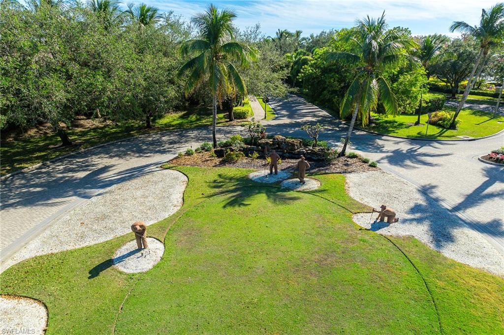Undisclosed Address Naples, FL 34113 - Photo 37 of 38 a view of a swimming pool with lounge chair