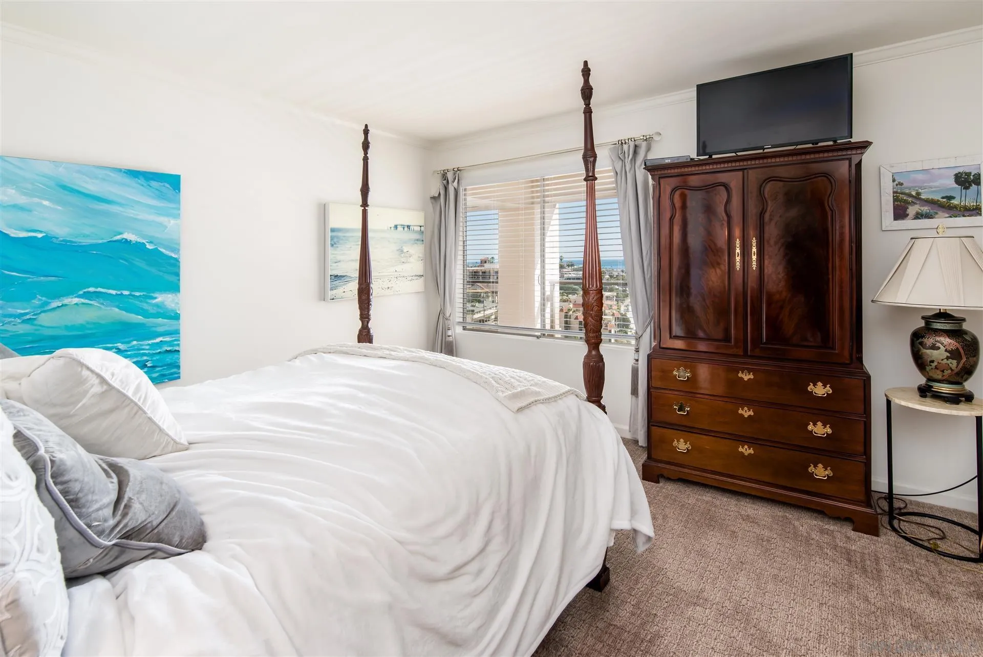 939 Coast Boulevard, Unit 16F La Jolla, CA 92037 - Photo 14 of 22 a bedroom with a bed and a dresser