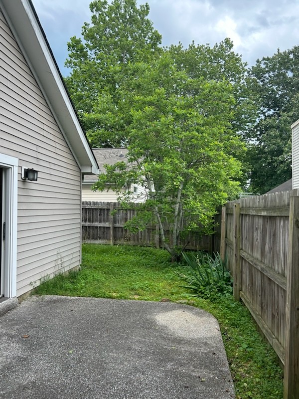2107 Apollo Drive Franklin, TN 37069 - Photo 9 of 9 a view of a backyard with plants and wooden fence
