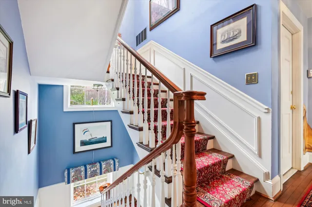 a view of entryway with stairs and wooden floor