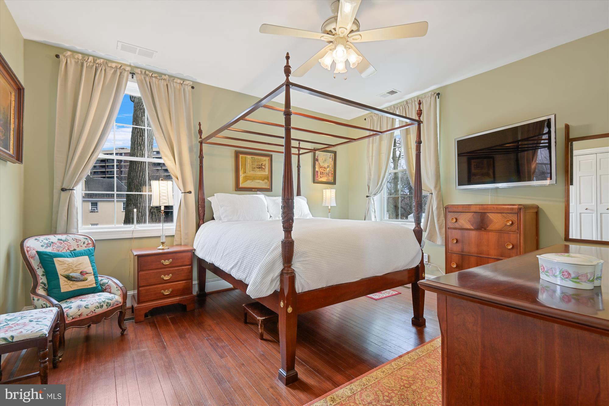 4220 North Charles Street Baltimore, MD 21218 - Photo 18 of 30 a bedroom with a bed window and a flat screen tv