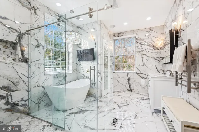 a spacious bathroom with a bathtub and shower