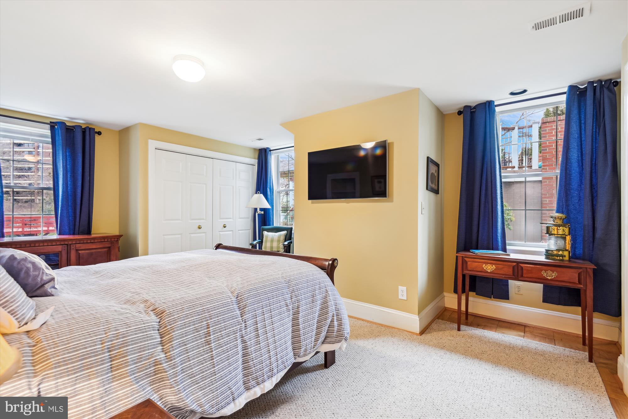 4220 North Charles Street Baltimore, MD 21218 - Photo 23 of 30 a bedroom with a bed and a television