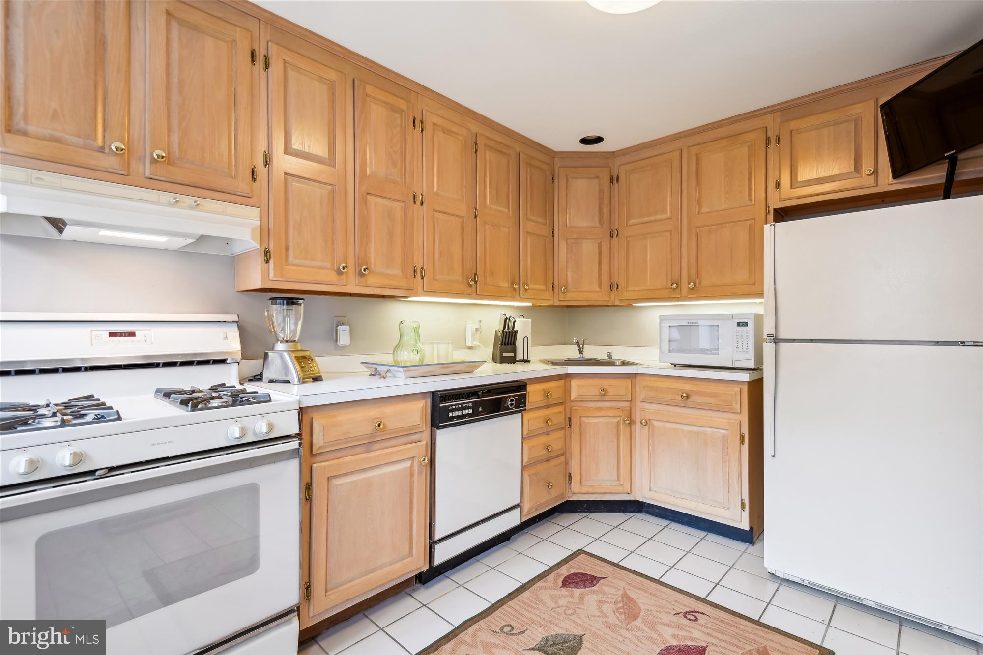 4220 North Charles Street Baltimore, MD 21218 - Photo 24 of 30 a kitchen with granite countertop cabinets stainless steel appliances and a sink