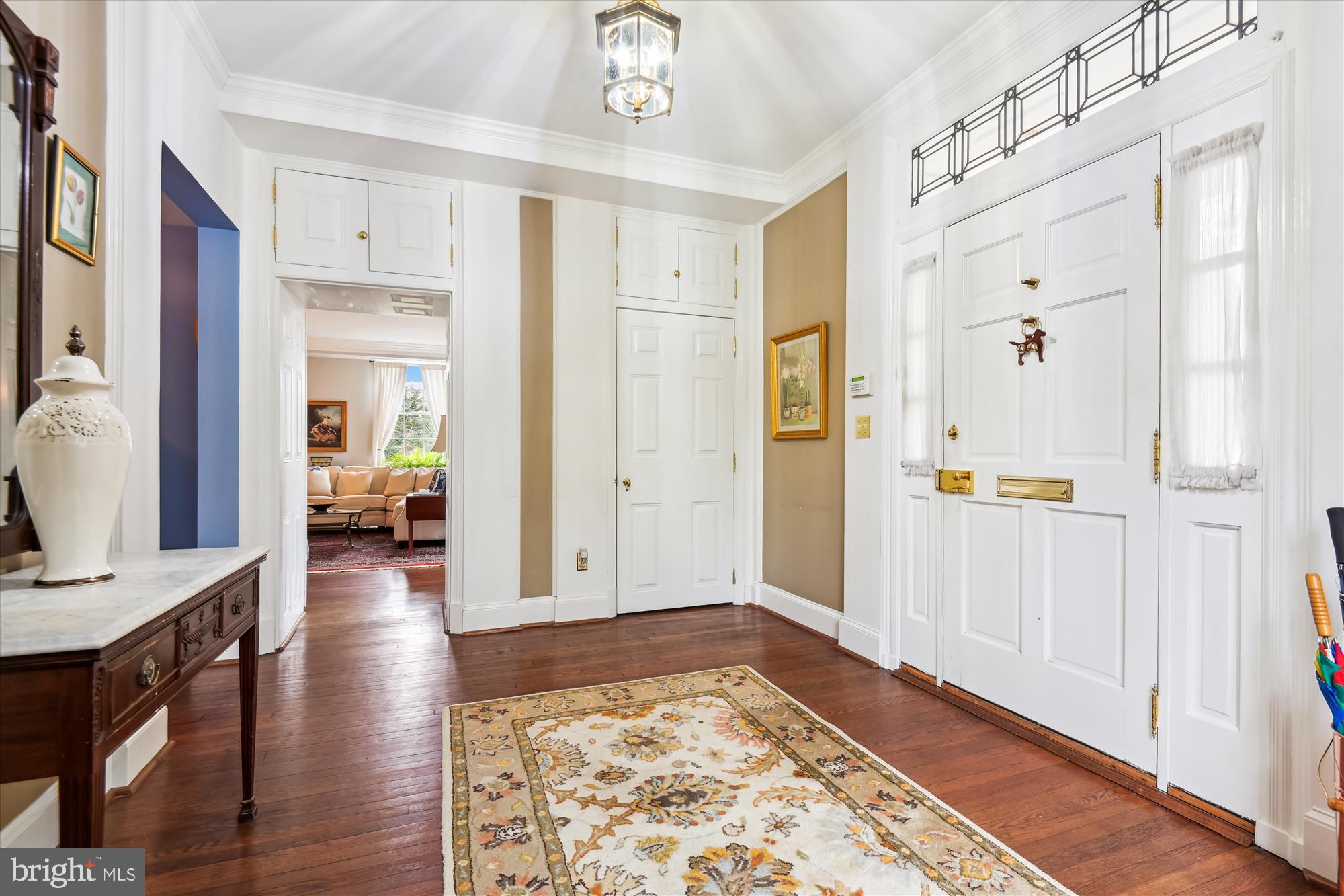 4220 North Charles Street Baltimore, MD 21218 - Photo 3 of 30 a view of a hallway with wooden floor and windows