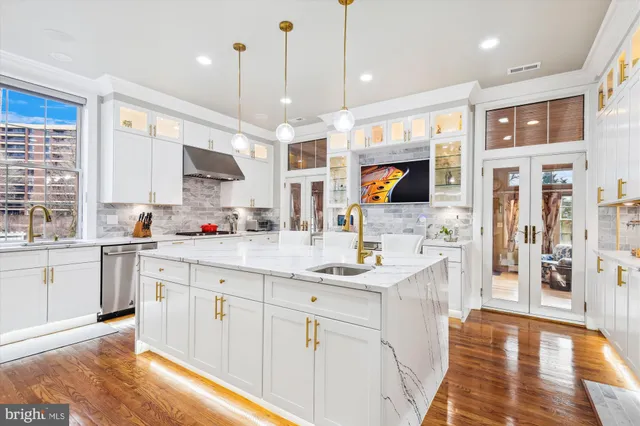 a kitchen with a sink window and cabinets