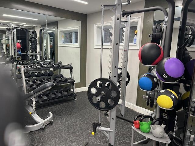 114 A Grove Street, Unit 2 Stamford, CT 06901 - Photo 6 of 10 a kitchen with a stove refrigerator and blue wooden floor