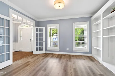 a view of a balcony with wooden floor