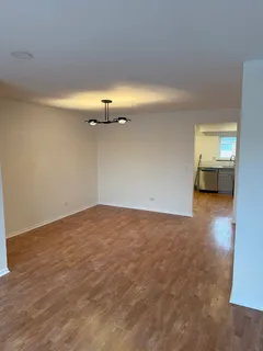 a view of a room with an empty space and a sink