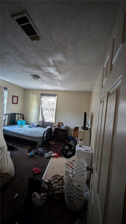 646 Straight Street Macon, GA 31204 - Photo 10 of 12 a bedroom with bed and window