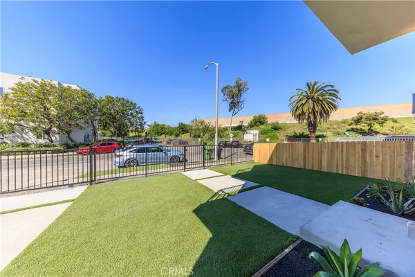 a view of a backyard with swimming pool
