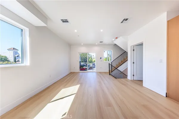 a view of entryway with wooden floor