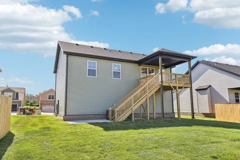 a view of a house with a big yard