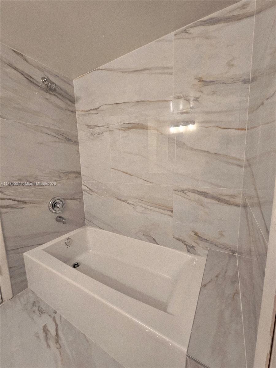 204 Foxtail Drive, Unit D1 Greenacres, FL 33415 - Photo 6 of 12 a bathroom with a bathtub
