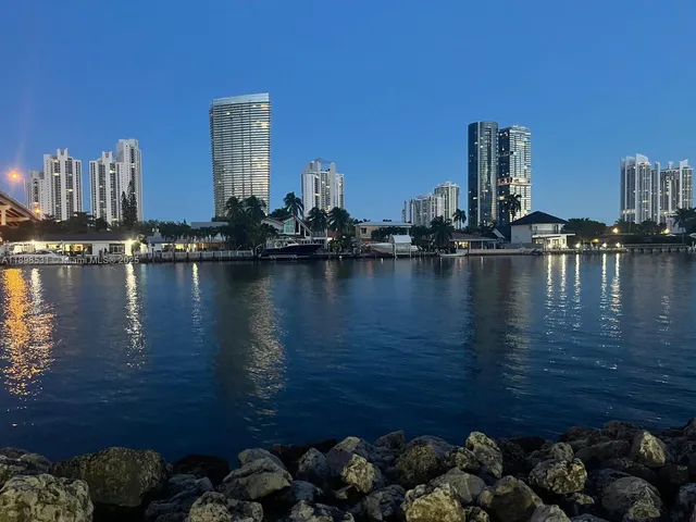 a view of a ocean with tall building