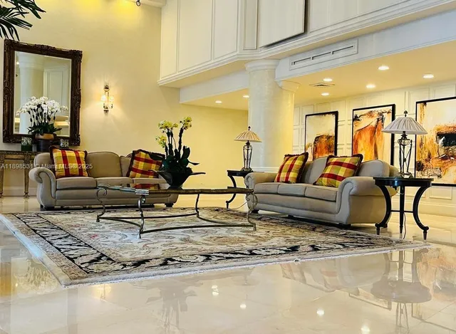 a living room with furniture and a rug