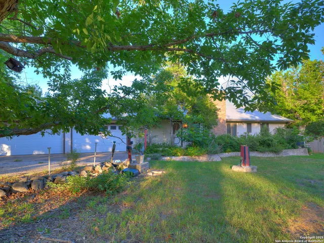a backyard of a house with lots of green space