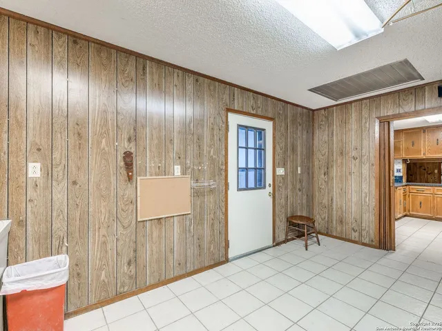 a kitchen with stainless steel appliances granite countertop a sink and cabinets