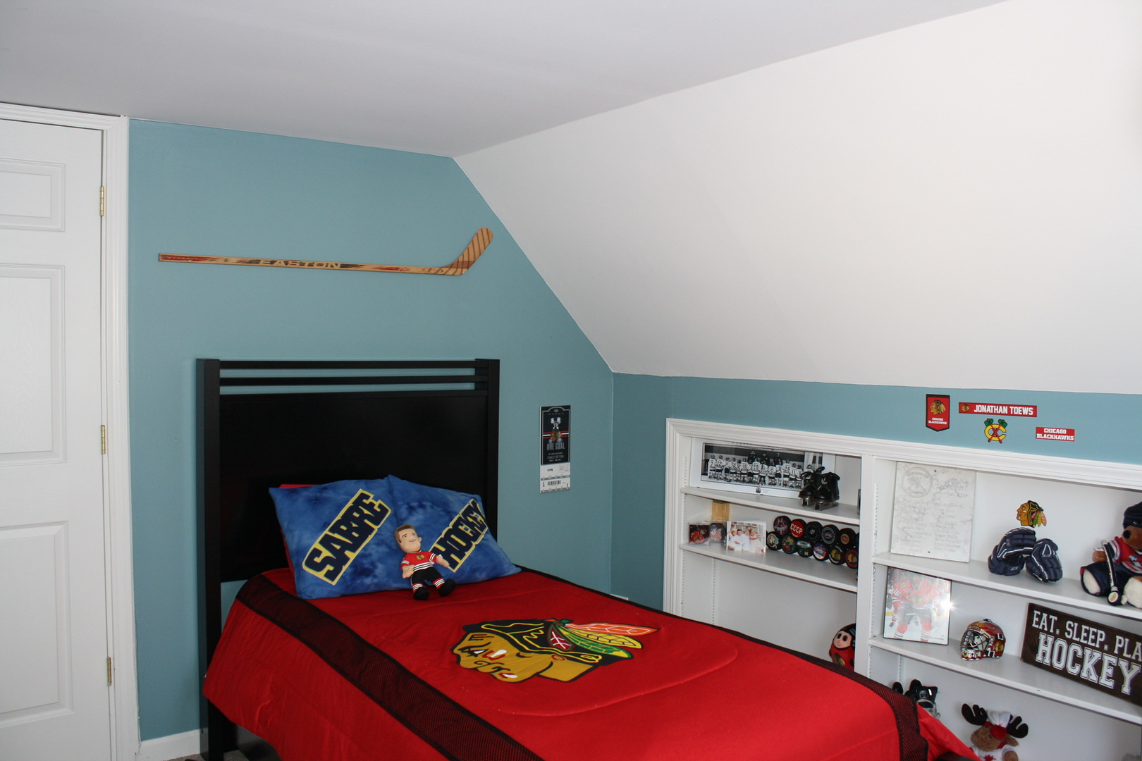 321 North Wright Street Naperville, IL 60540 - Photo 11 of 23 a bedroom with a bed and a book shelf