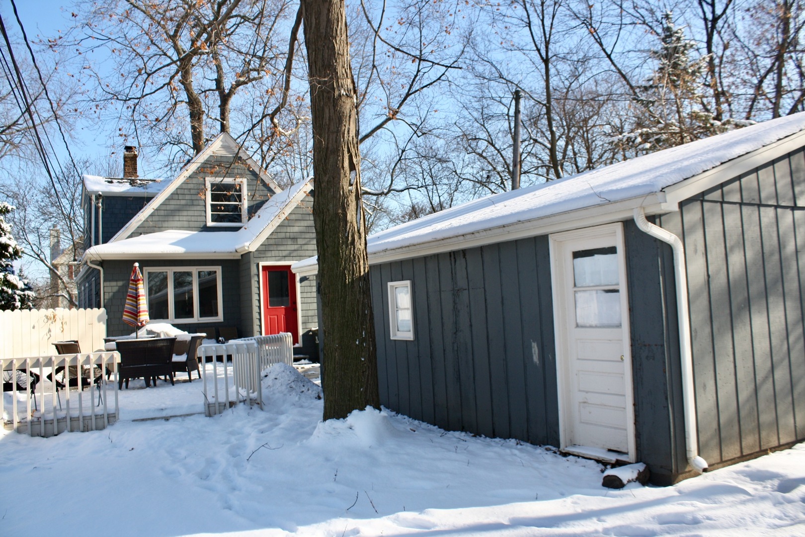 321 North Wright Street Naperville, IL 60540 - Photo 22 of 23 a backyard of a house with table and chairs