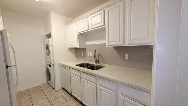 a kitchen with a stove microwave and refrigerator