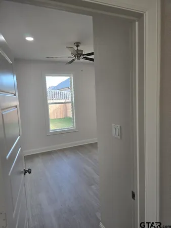 a view of an empty room and a window