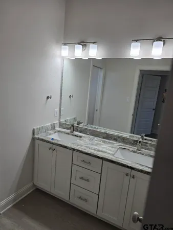 a bathroom with a toilet and a bathtub