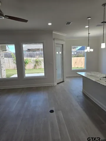 a view of an empty room and window