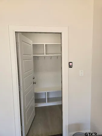 a view of an empty walk in closet