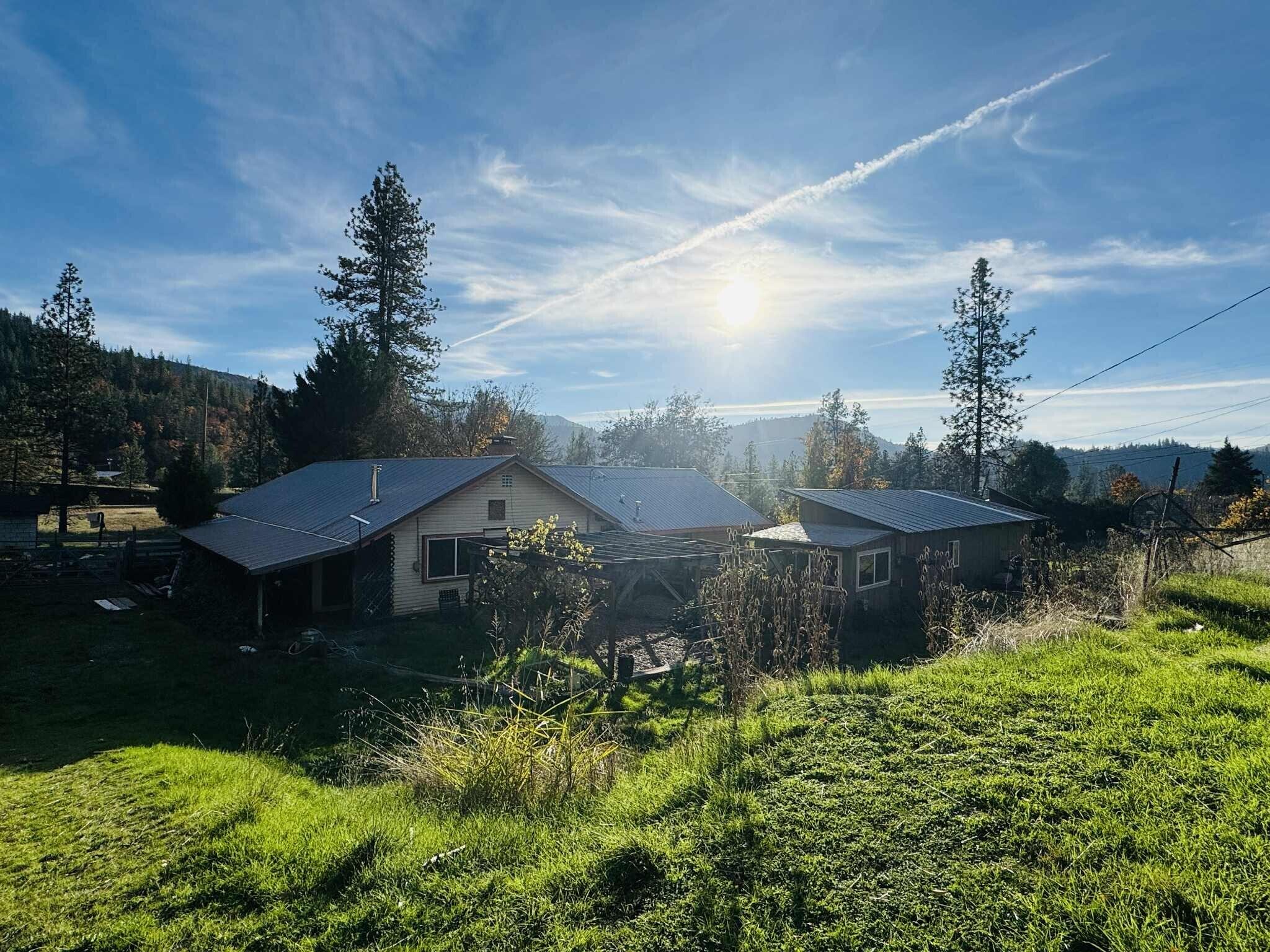 191 Henrietta Road Lewiston, CA 96052 - Photo 12 of 12 a front view of a house with a yard and potted plants