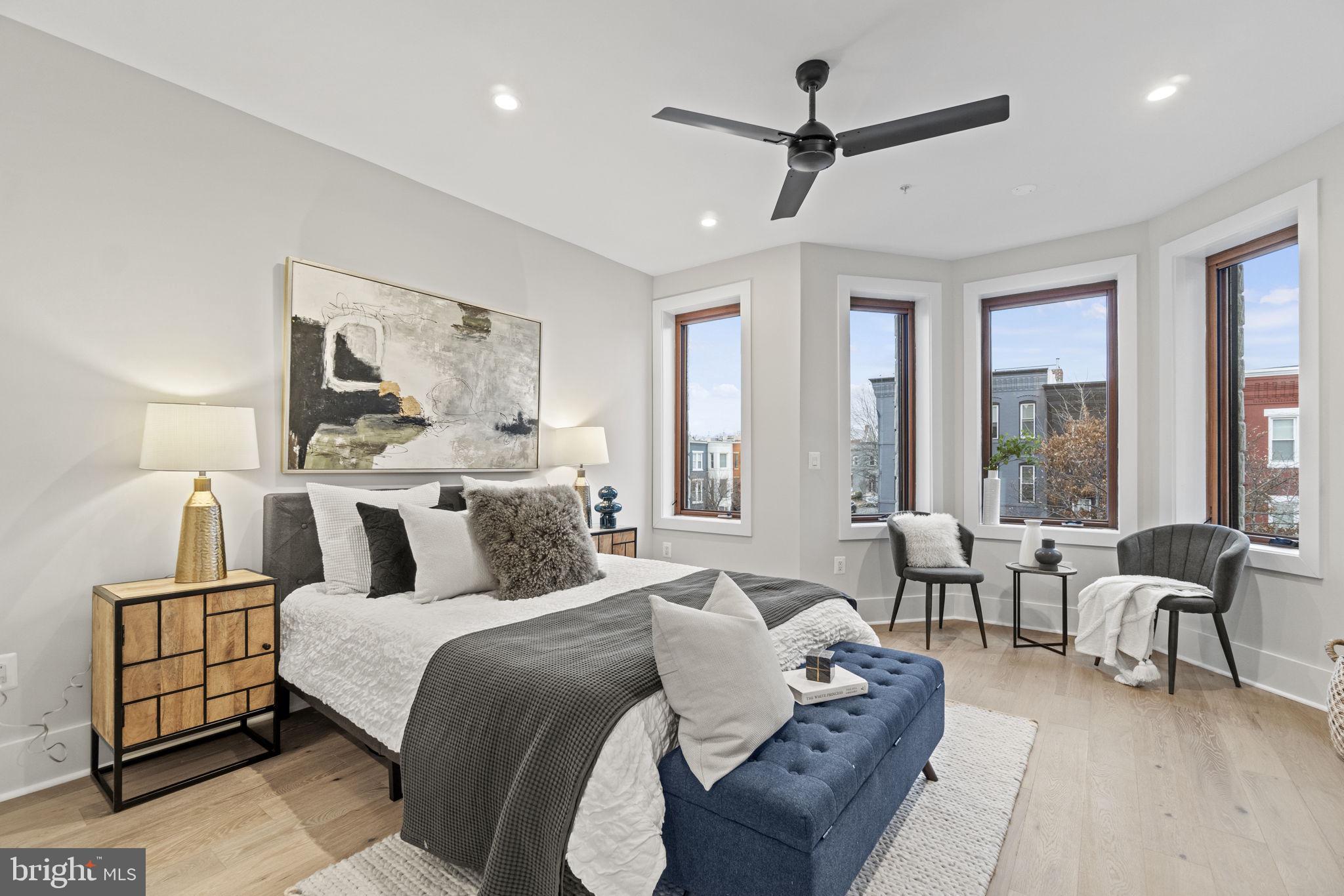 92 R Street Northwest Washington, DC 20001 - Photo 13 of 36 a bedroom with a large bed couch and a large window