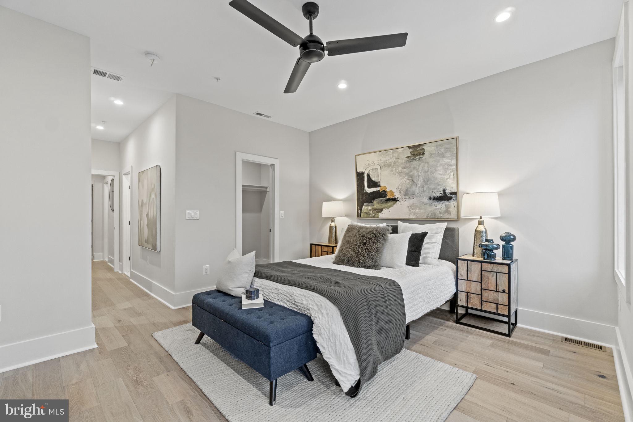 92 R Street Northwest Washington, DC 20001 - Photo 15 of 36 a bedroom with a bed and a chandelier