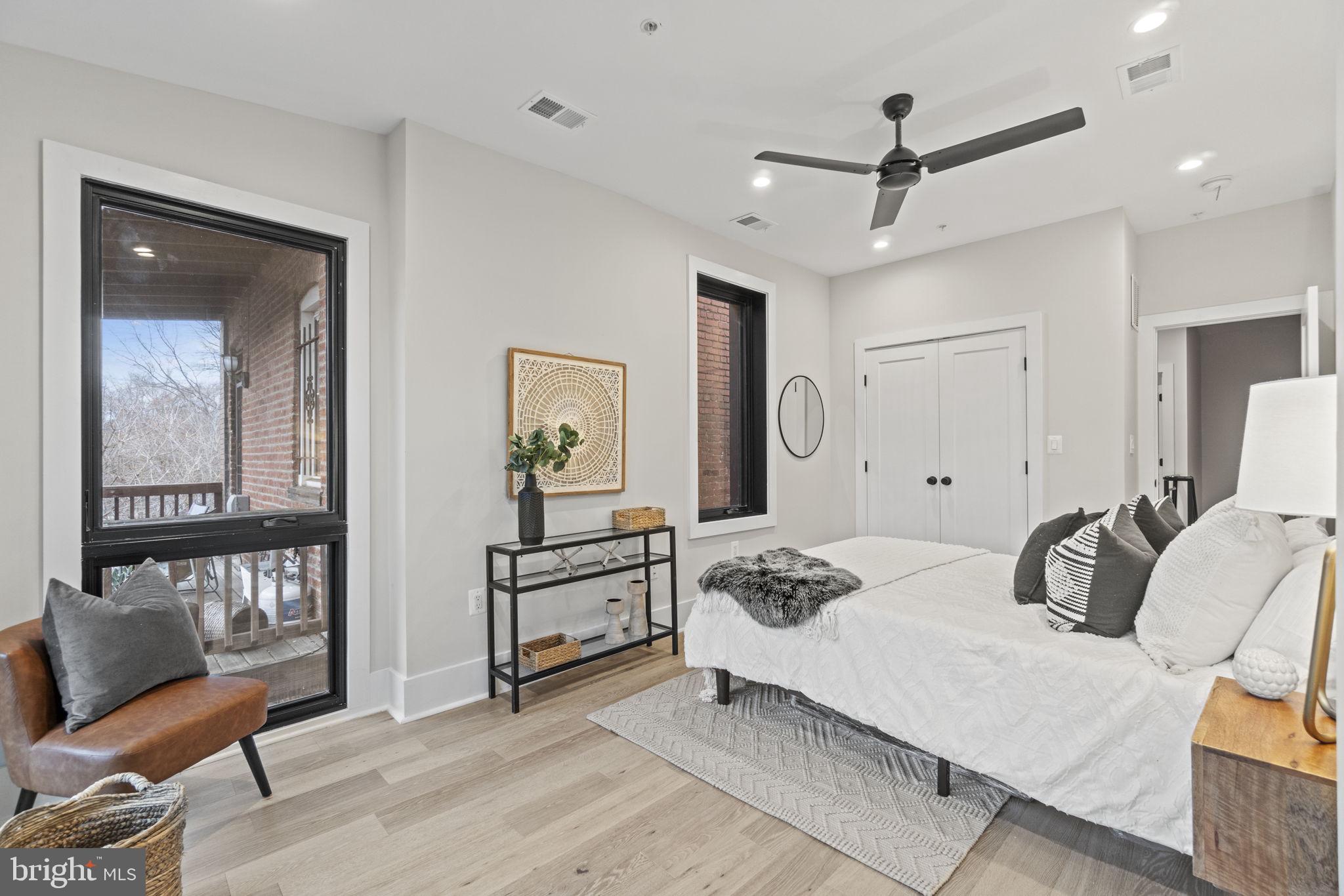 92 R Street Northwest Washington, DC 20001 - Photo 18 of 36 a bedroom with furniture and a wooden floor