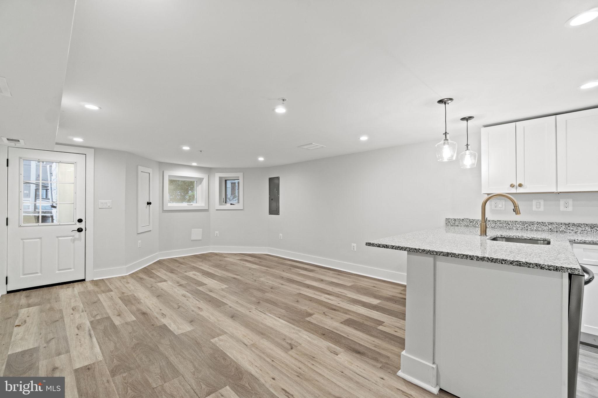 92 R Street Northwest Washington, DC 20001 - Photo 22 of 36 a kitchen with granite countertop sink and cabinets