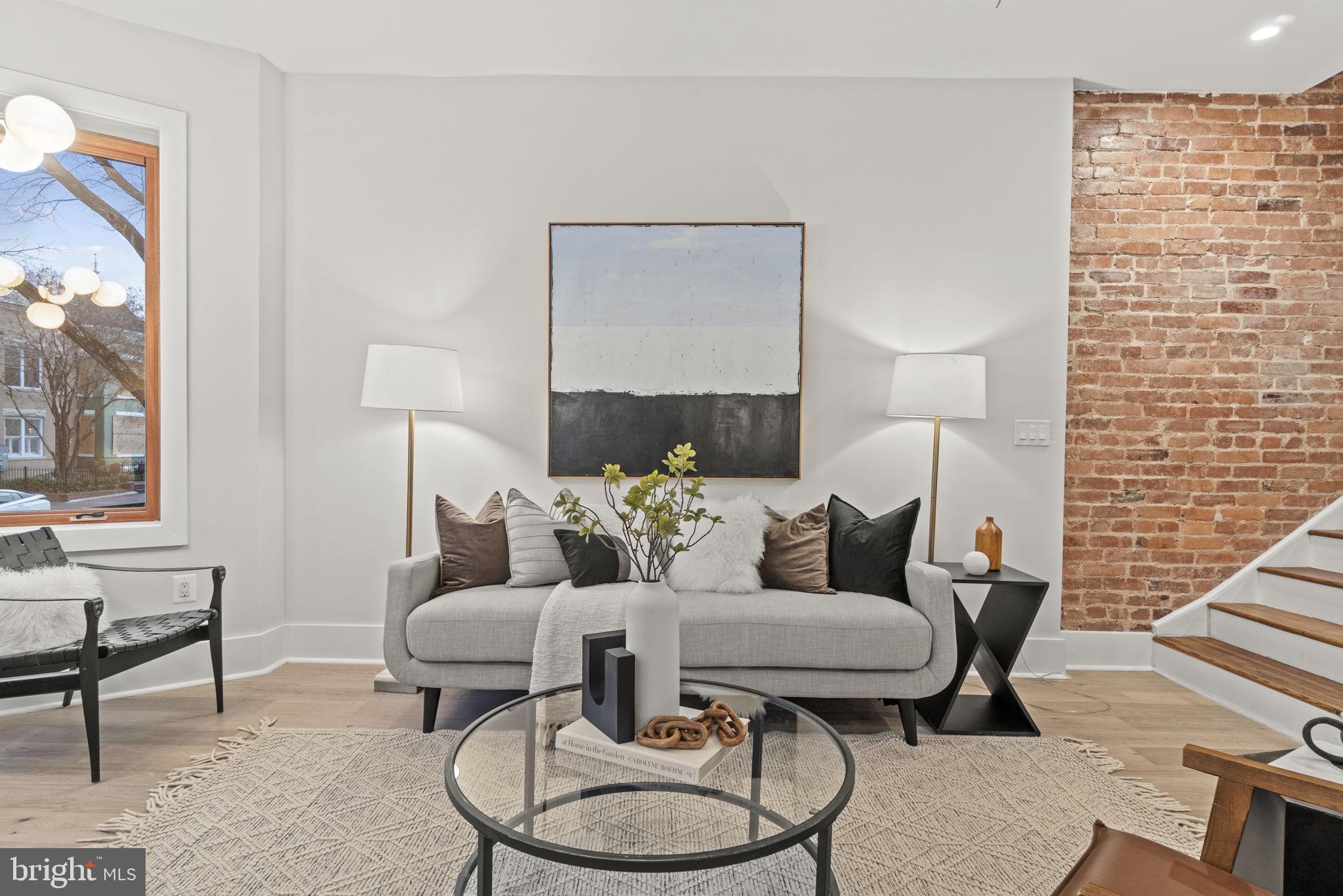 92 R Street Northwest Washington, DC 20001 - Photo 3 of 36 a living room with furniture a lamp and a potted plant